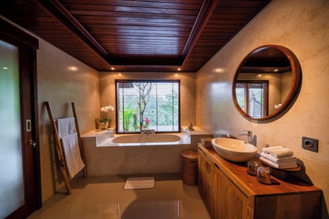 Separate tub and shower, hair dryer, slippers, towels