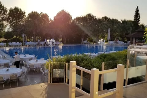 Indoor pool, outdoor pool, open 6:00 AM to 11:00 PM, pool umbrellas