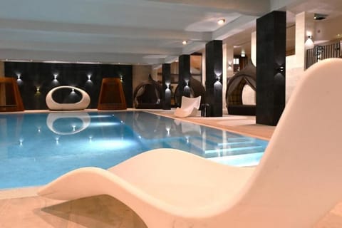 Indoor pool, outdoor pool, open 7:00 AM to 9:30 PM, sun loungers