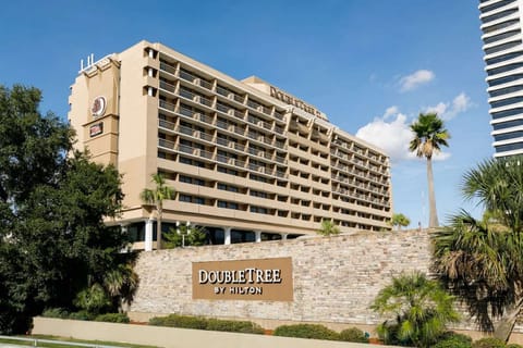 DoubleTree building with palm trees and blue sky