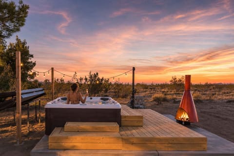 Sunset spa soaks accompanied by the gentle glow of the malm fireplace - truly a one-of-a-kind experience!