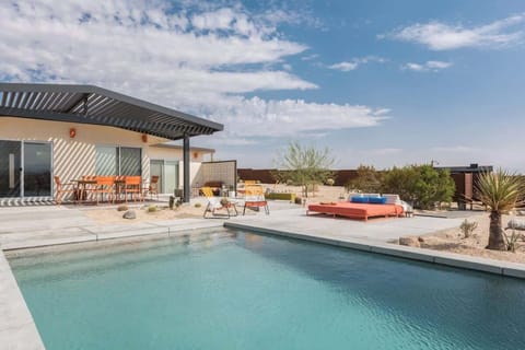 Welcome to Joshua Tree Improper - with high-style design, a saltwater pool, hot tub, firepits, stunning views, and surprises around every corner.