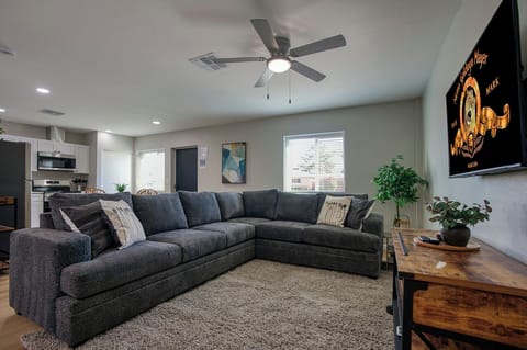Relax in this spacious living room—your stay helps feed families in need.