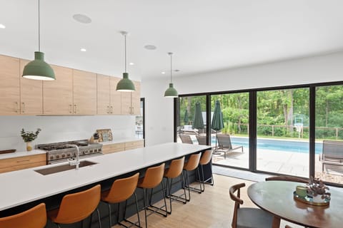 Bright, open kitchen with 48’’ range and 14-foot island