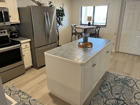 Kitchen with breakfast high top and island.