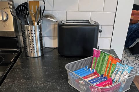 Toaster, utensils, and complimentary snacks for easy mornings.