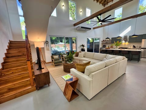 Spacious living room with soaring ceilings and natural light