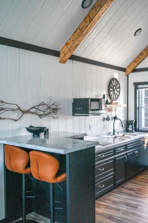 The kitchenette is equipped with a microwave, mini refrigerator, drip coffee maker, and hot plate.