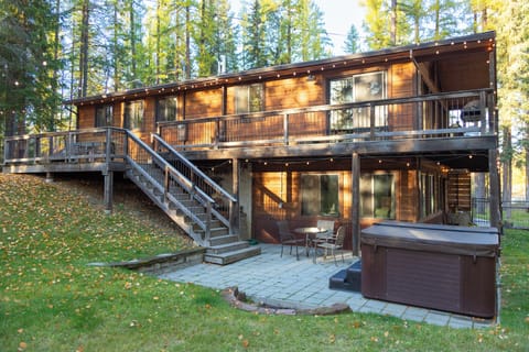 Relax in the backyard with outdoor seating and a comfortable hot tub!