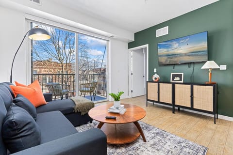 Living Room: Stylish retreat with sleek decor, balcony views, and a smart TV for entertainment!