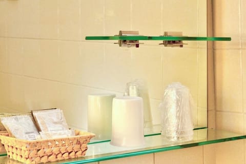 Economy Quadruple Room | Bathroom amenities | Shower, toilet paper