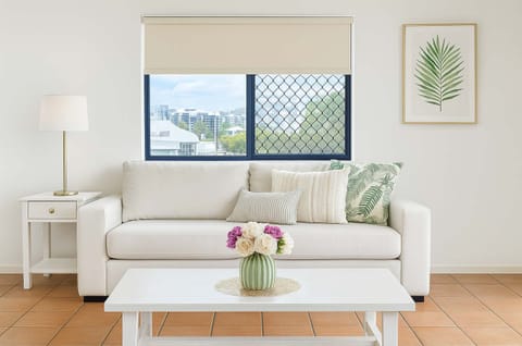 Bright living area with sofa and natural light