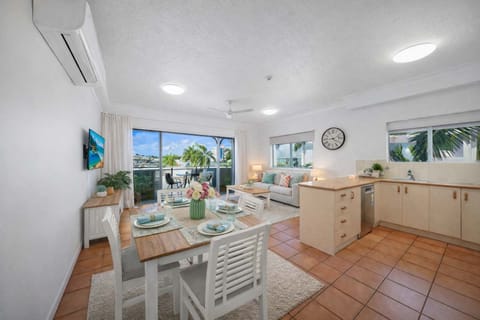 Bright, open living area with indoor–outdoor flow and marina breezes