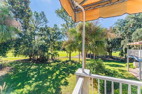 Step outside onto the covered, furnished porch to bask in breathtaking golf course views and to unwind after a day of activities, immersing yourself in the tranquility of the surroundings.