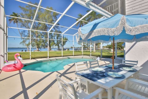 Caged In Pool Area W/ Outdoor Seating