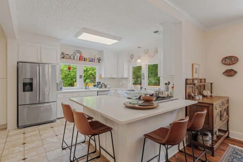 Whether you're preparing a family dinner or entertaining colleagues, this kitchen is built for both function and style.