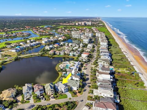 Home's location across from the ocean, backyard lake views, community pools