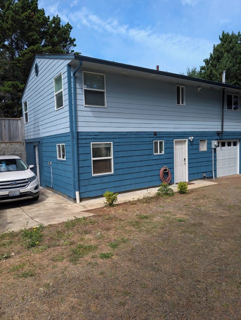 Back of the house - access is on this level at the white door.
