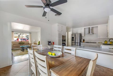Open dining space with seating for six and easy access to the kitchen
