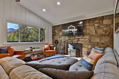 Comfy seating, a wood-burning stove, smart TV and stunning mountain views, perfect for unwinding after a day of adventure.