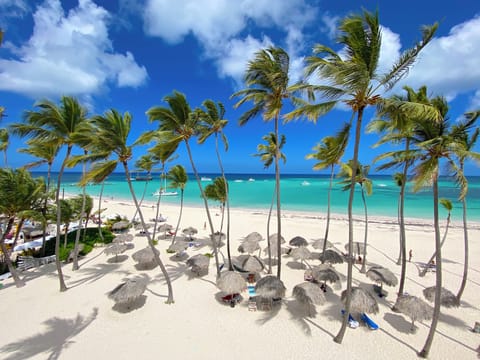 On the beach, white sand, beach towels, beach massages