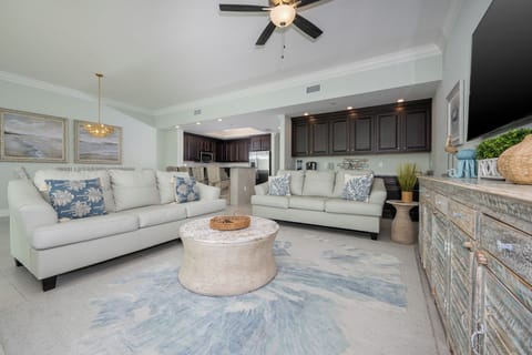 Gather in this welcoming living space and enjoy stunning beach views through the windows