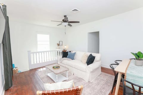 Second floor common living room with extra desk and chairs.