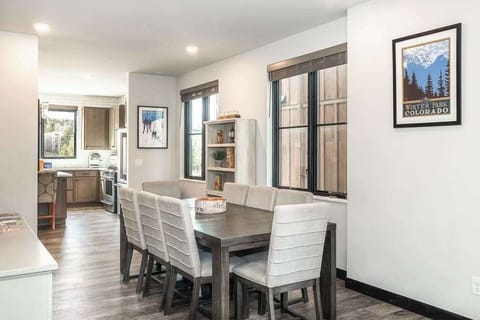 Gather around a sunlit dining table that invites connection, conversation, and lingering moments after a day of adventure.
