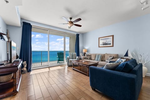 Living Room with Ocean View – Bright living room with floor-to-ceiling windows and breathtaking Gulf panorama.
