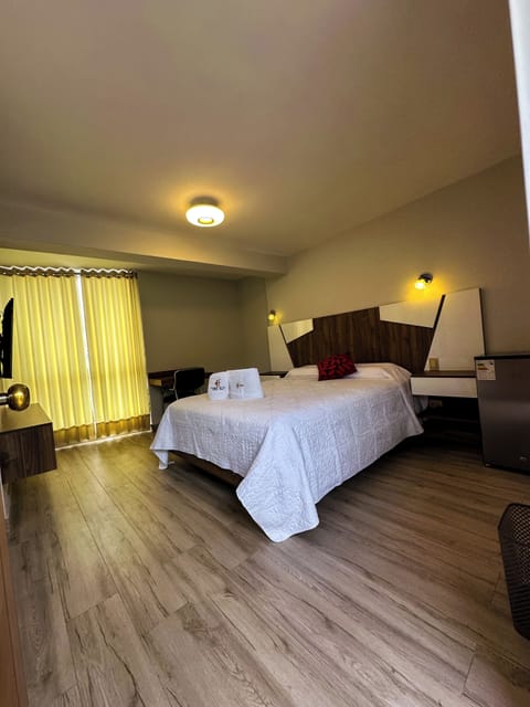 Deluxe Room, Garden View | Down comforters, Select Comfort beds, desk, laptop workspace