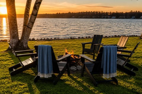 Sit back and relax around the firepit as you watch the sunset over Lake Ann.