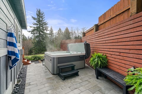 Hot Tub Daytime – Soothing hot tub surrounded by privacy fence