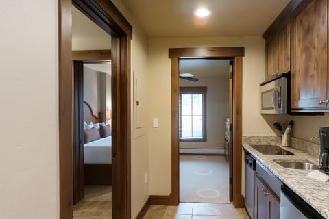 Kitchenette in each suite with frig, microwave, coffee pot and dishwasher.