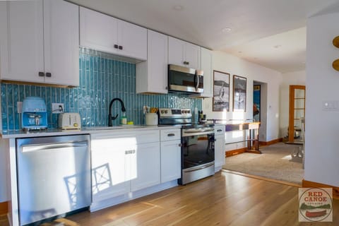 Fully equipped kitchen with stainless appliances and plenty of counter space for preparing meals.