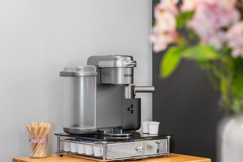 Start your morning right with freshly brewed coffee from your private Keurig station, complete with a selection of pods and stirrers for the perfect cup