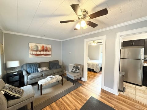 Cozy living room featuring a plush sofa and comfy chairs.