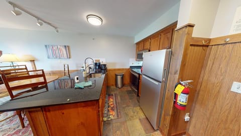 Spacious kitchen with cozy dining nook and modern appliances