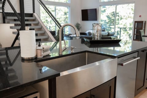 Kitchen details: clean and ready to go with dish soap, towels, and room to prep.
