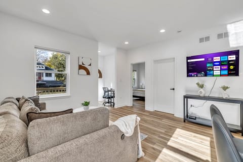 Thoughtfully furnished living room with a calm and cozy ambiance