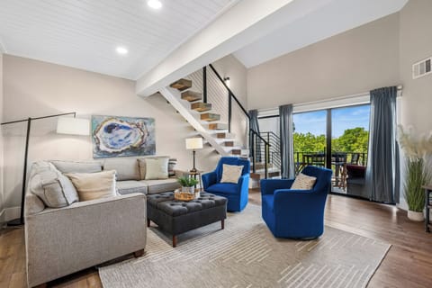 Spacious living area with outdoor views and a flatscreen tv.