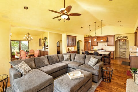 Open-concept living/kitchen/dining room with plush seating and space to spread out.