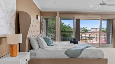 Comfortable, expansive bedroom with a peaceful outdoor terrace
