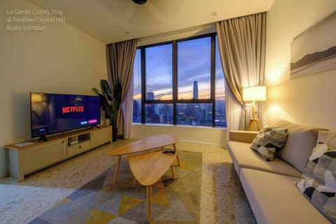 Enjoy spectacular view of KL city landscape in our 2 bedroom home at Pavilion Ceylon Hill, walking distance to Bukit Bintang, Changkat area. Shown is a spacious living room with 60" 4K TV with Netflix for your entertainment 