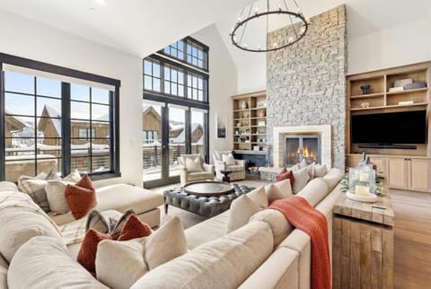 Living room (main floor): Wood-burning fireplace, Smart TV, vaulted ceilings