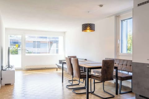 Bright dining area with large windows and natural light