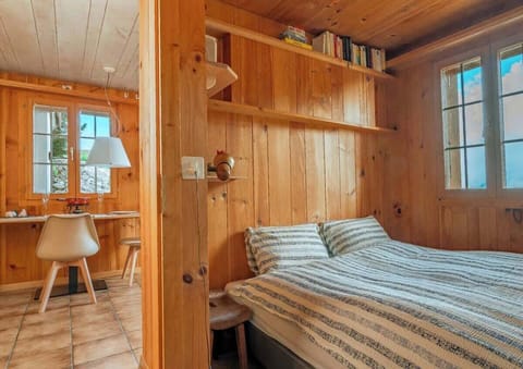 Another bedroom angle showing cozy details and alpine atmosphere.