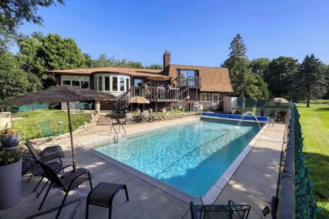 Our fenced in backyard is host to a hot tub open year round, heated pool open Memorial Day to Labor Day, lounge furniture, dining set, gas grill, pool furniture and pool toys.