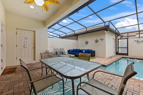 Your own private oasis! Enjoy Florida living year-round with a screened-in pool, outdoor dining, and cozy lounge seating.