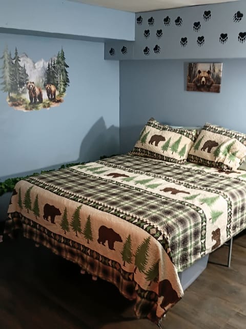 Unwind in our inviting sleeping quarters, featuring a warm, nature-theme room.