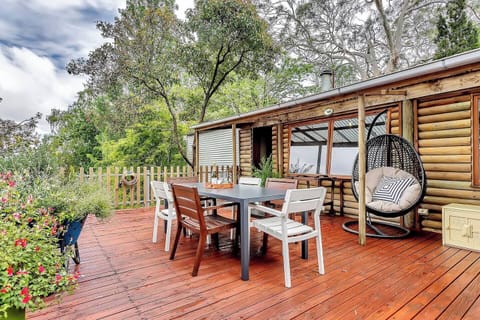 Step onto the private deck to take in sweeping views of the surrounding forest, the perfect spot for morning coffee or quiet reflection above the canopy.